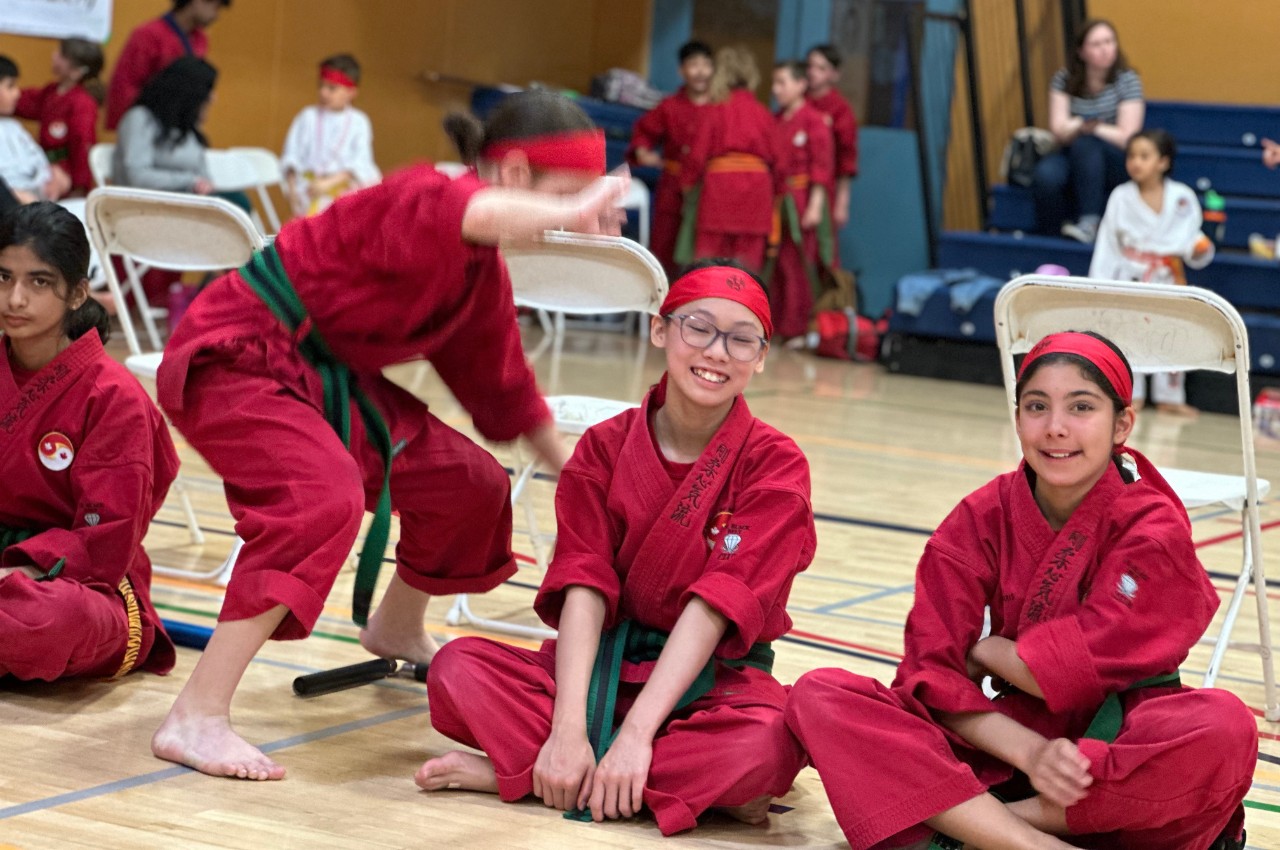Martial arts instructor with kids