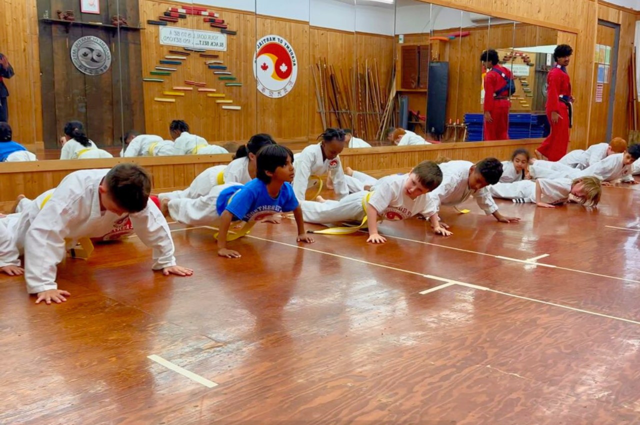 Martial arts instructor with kids