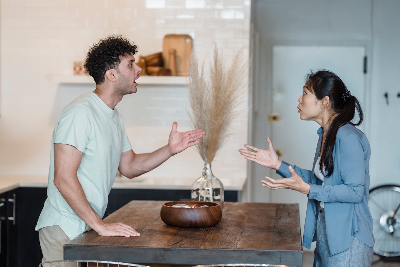 couple arguing in kitchen