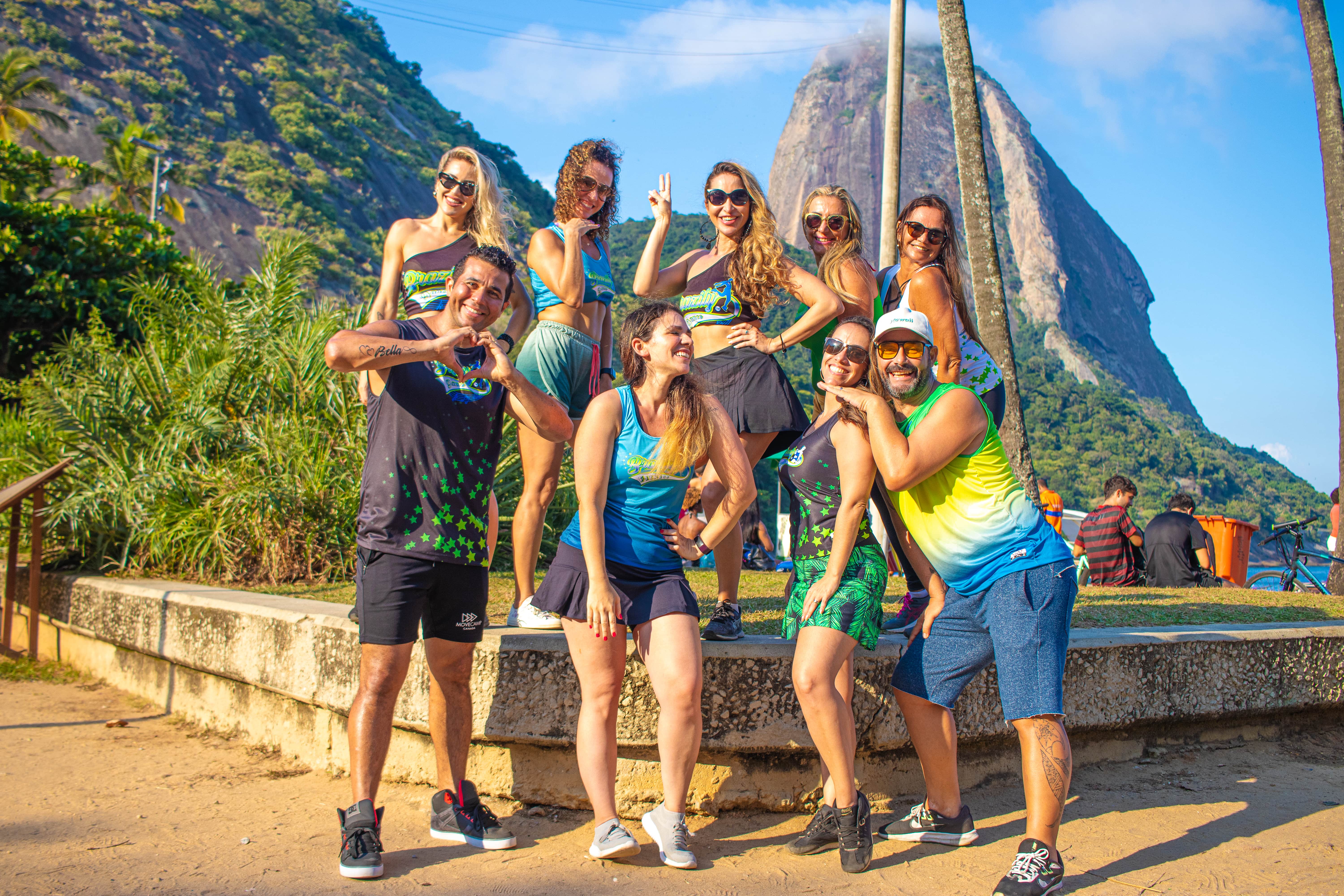 Happy people at beach, in front of sugar loaf mountain, Rio de Janeiro, Brazil 