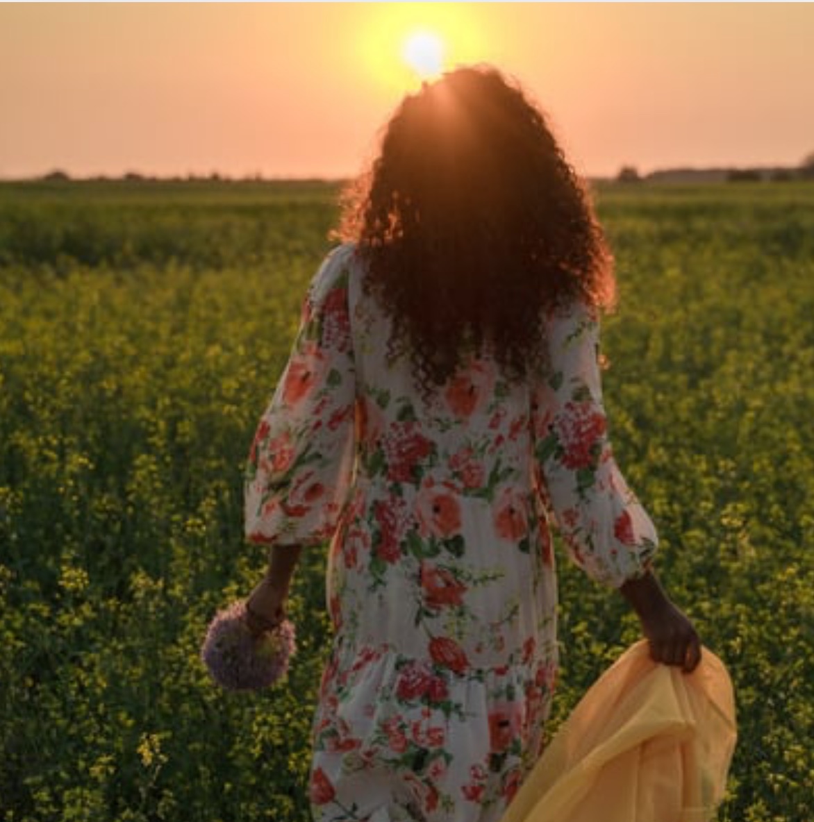 woman walking in the sunset