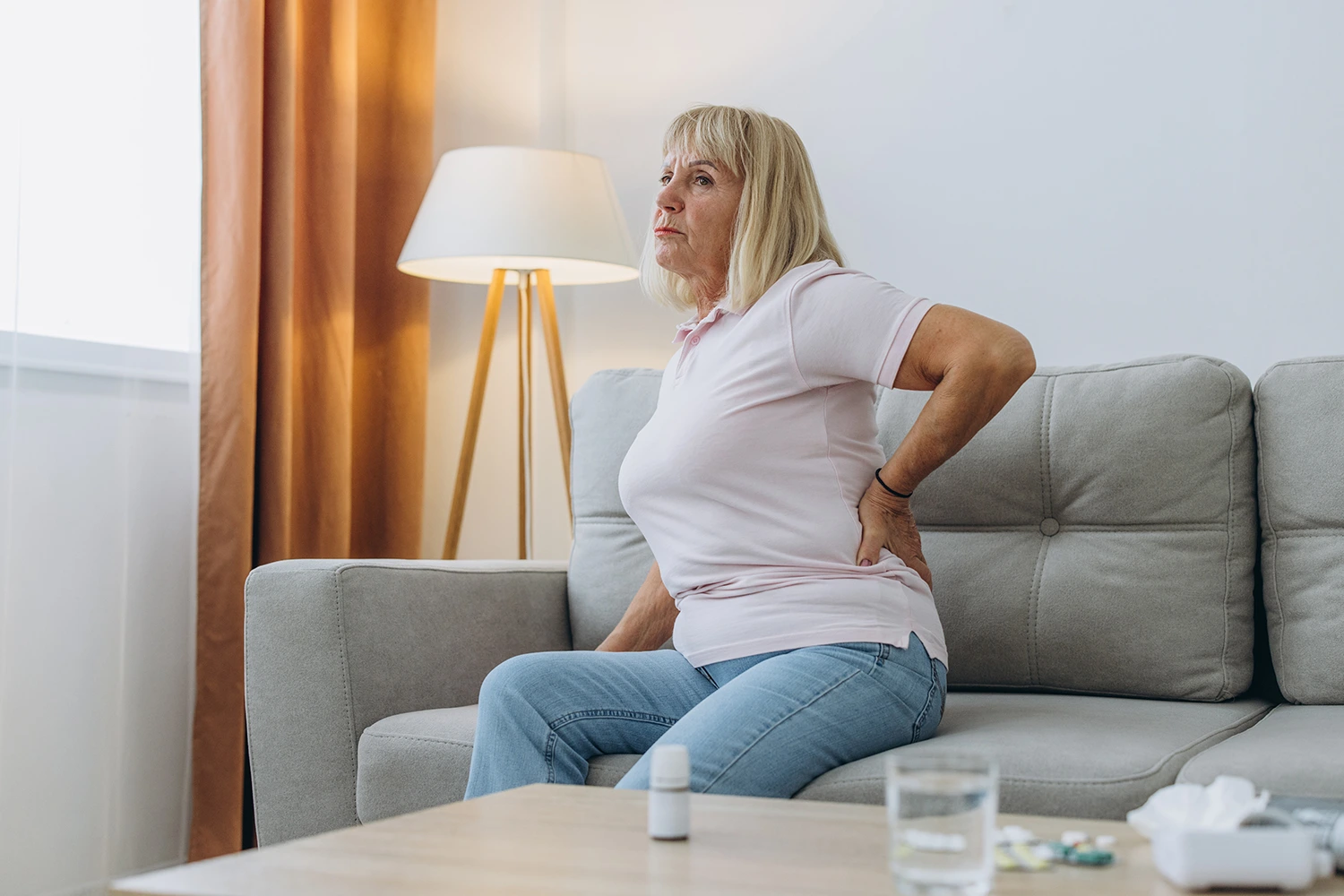 Senior woman having backpain