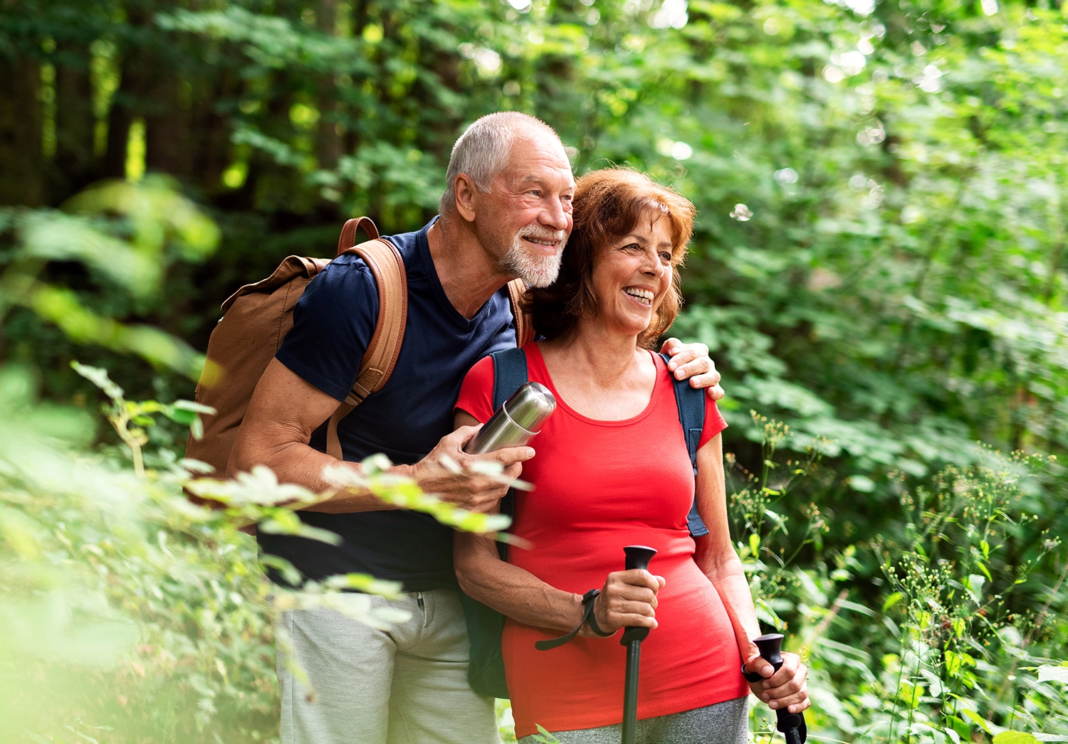 Old couples with backpack hiking