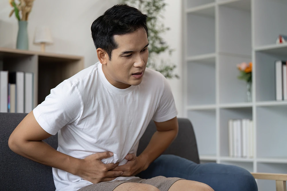young man having abdominal pain