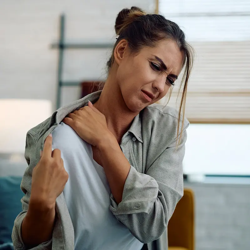 Patient with shoulder pain during examination