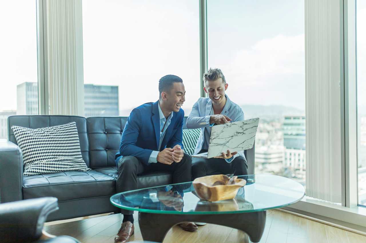 Two persons discussing in an office Two persons discussing in an office