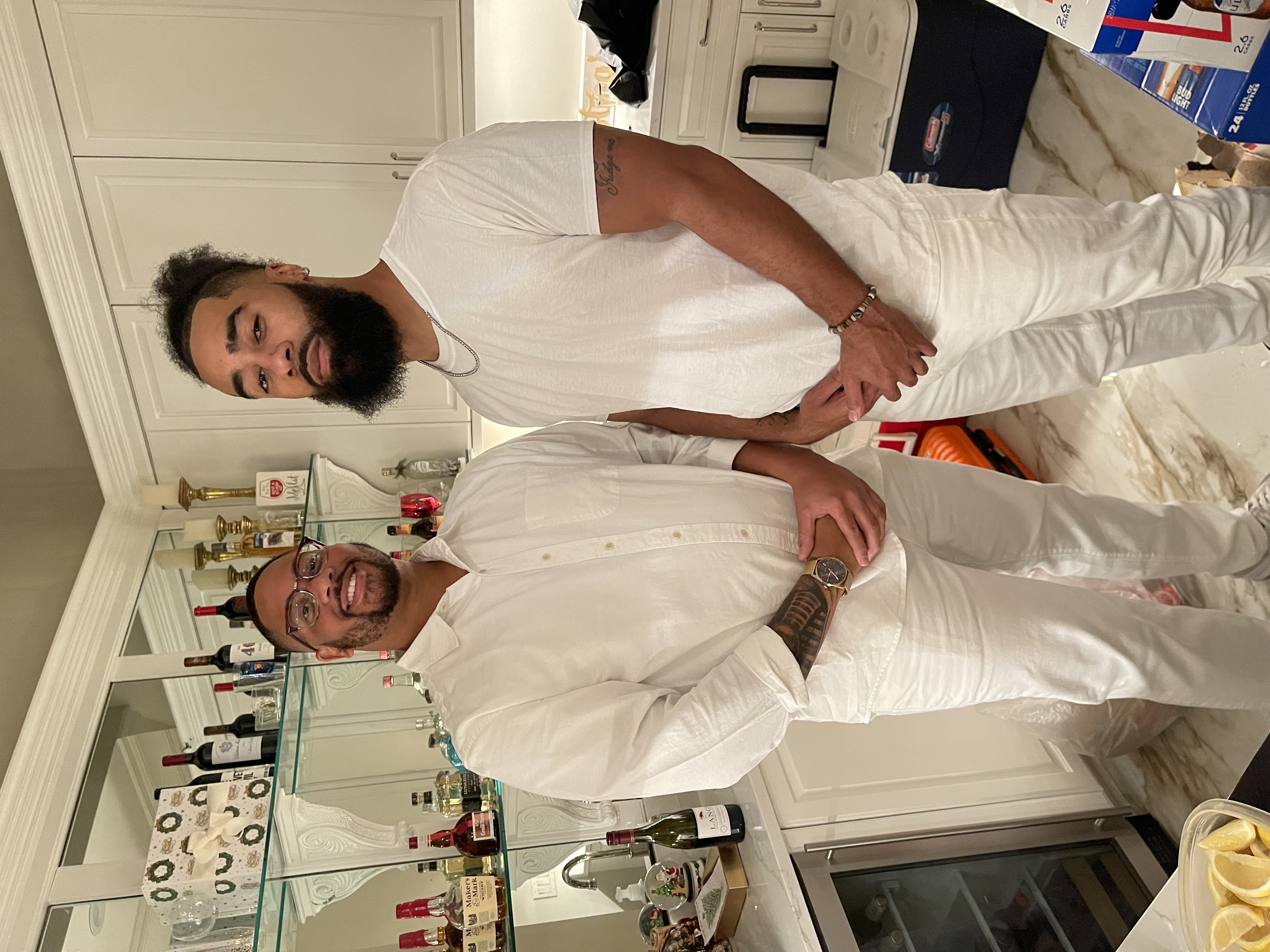 Backyard party with a mobile bar and guests enjoying cocktails