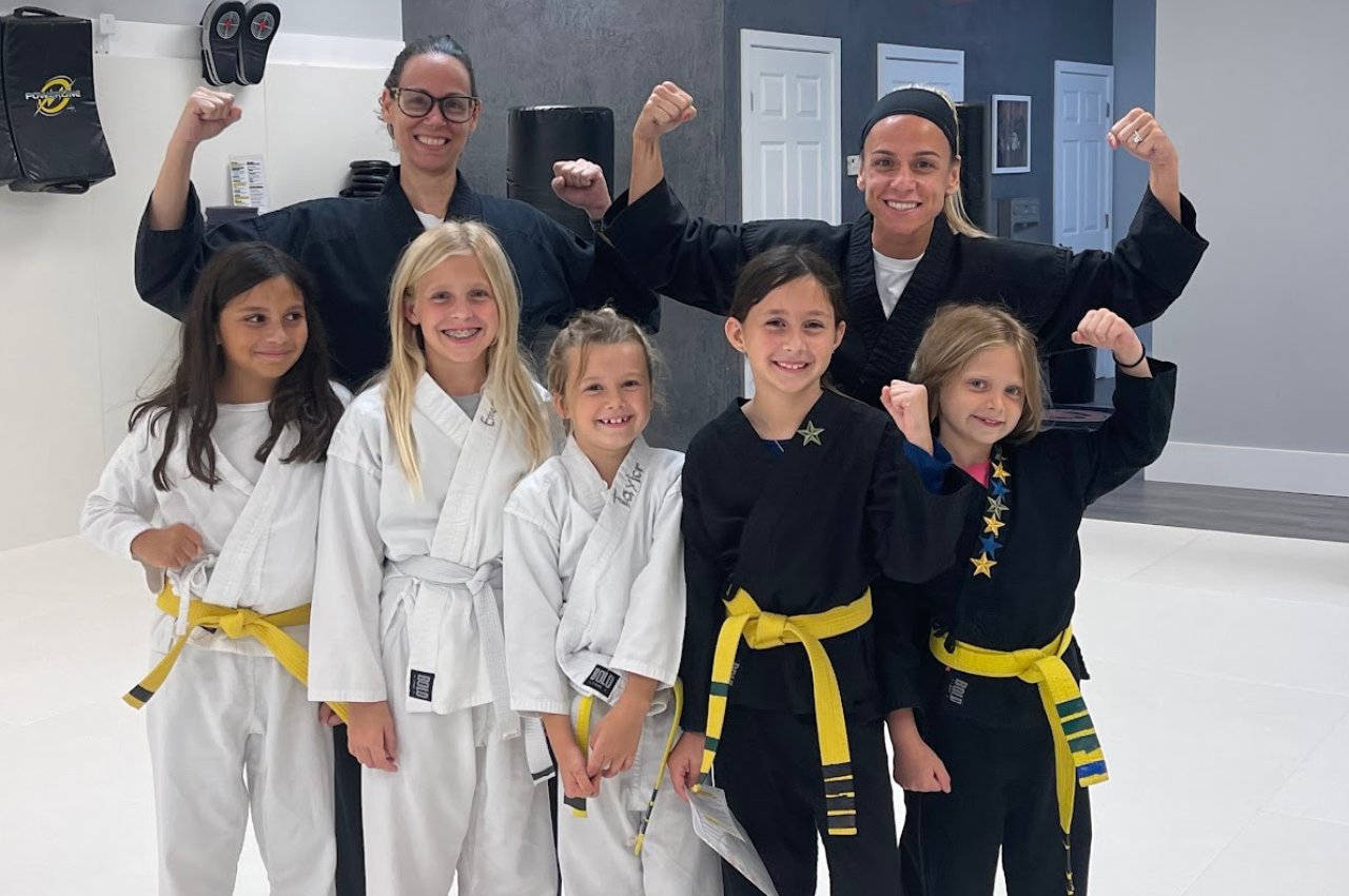 Martial arts instructor with kids