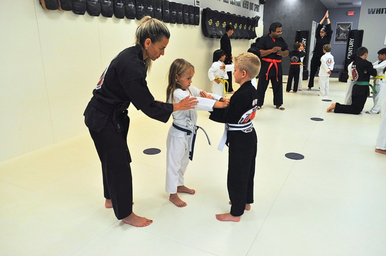 Martial arts instructor with kids