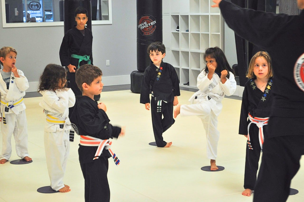 Martial arts instructor with kids