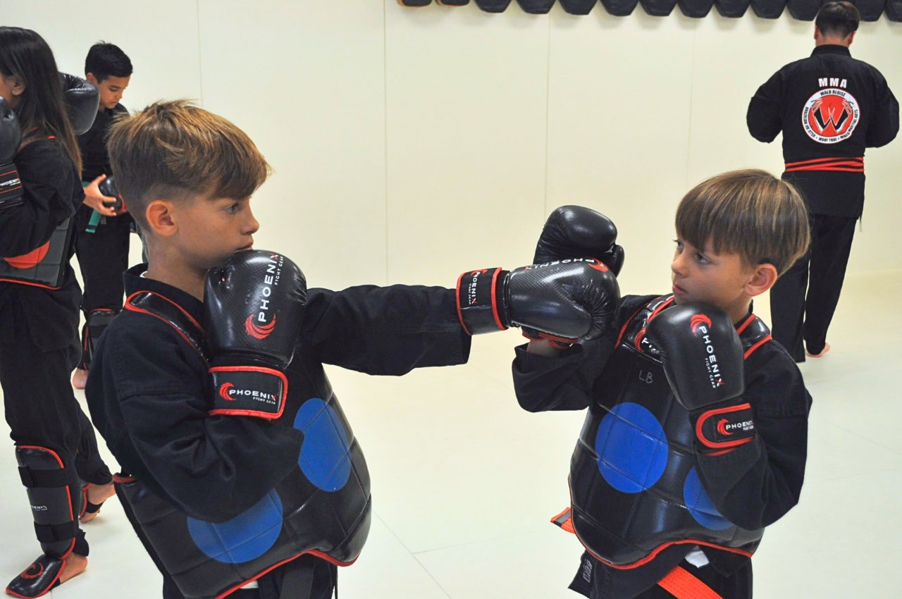 Martial arts instructor with kids