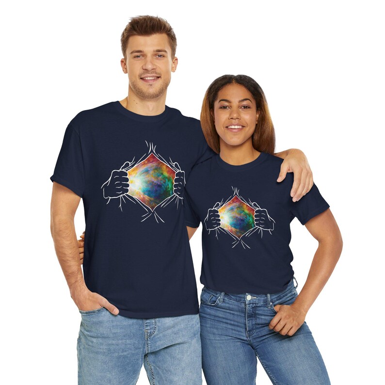 Embrace the universal connection between you and the cosmos with this Uplifting Graphic Design T-Shirt, featuring hands unveiling a galaxy as a powerful representation of unlocking your potential and limitless possibilities Embrace the universal connection between you and the cosmos with this Uplifting Graphic Design T-Shirt, featuring hands unveiling a galaxy as a powerful representation of unlocking your potential and limitless possibilities