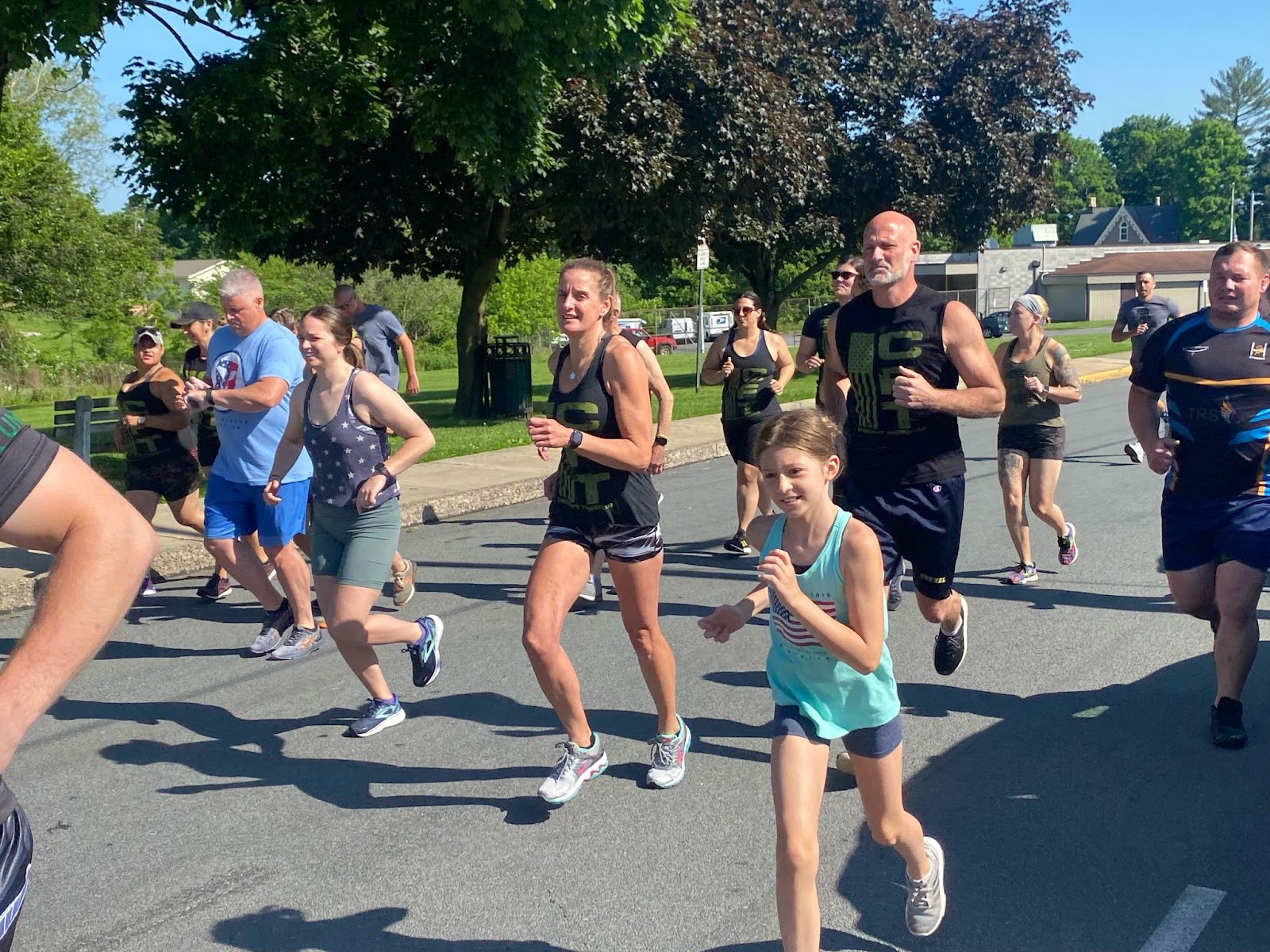 Members high-fiving after a workout