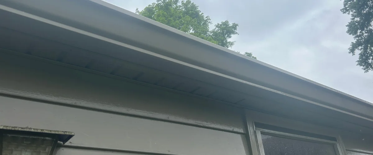Clean house gutters after professional exterior cleaning