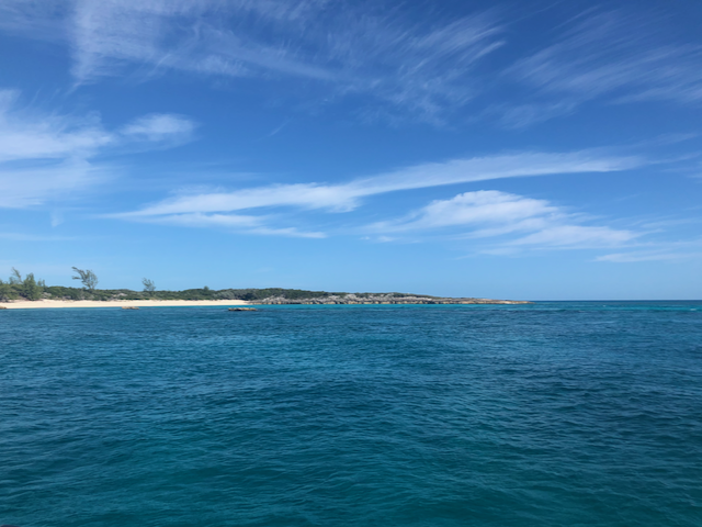 Sailing Highbourne Cut, passing the Exuma Island Chain in The Bahamas and the variety of blue hues of the Exuma Sound. Sailing Highbourne Cut, passing the Exuma Island Chain in The Bahamas and the variety of blue hues of the Exuma Sound.