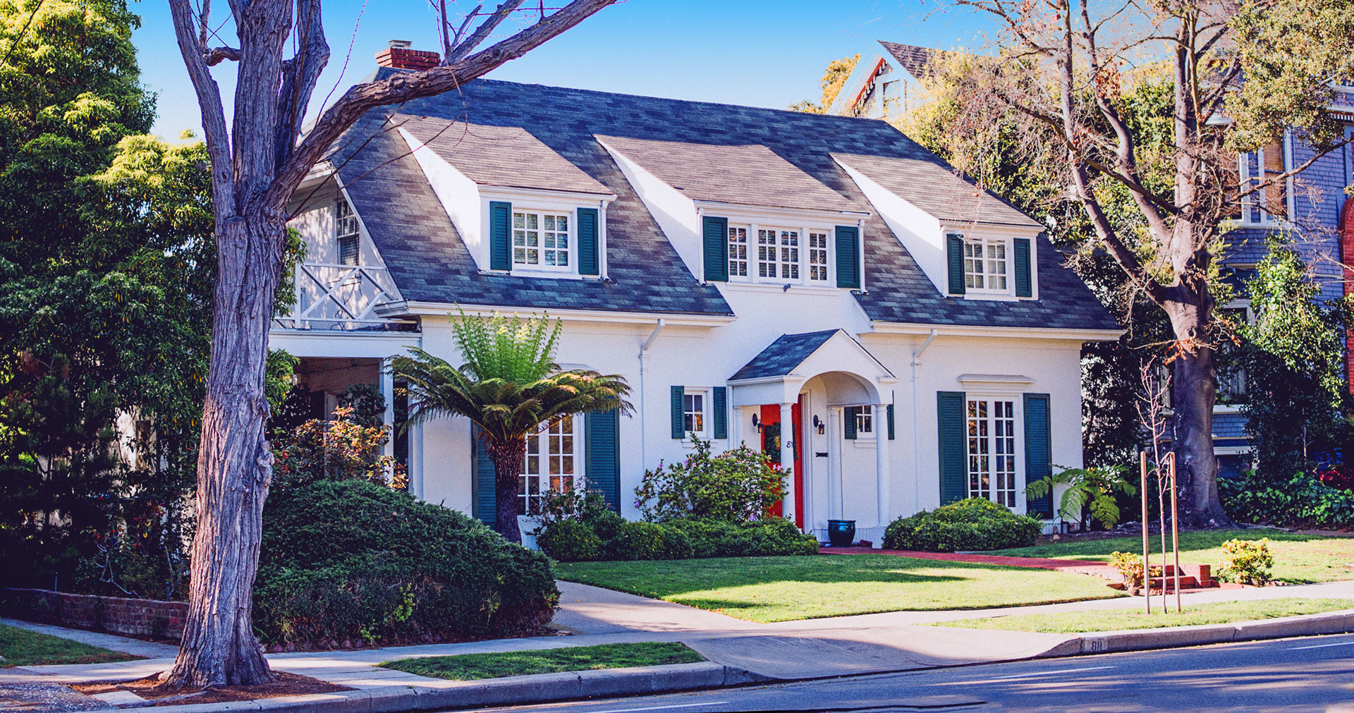 A real estate investors looks at a house in a nice suburb to consider funding sources from his retirement