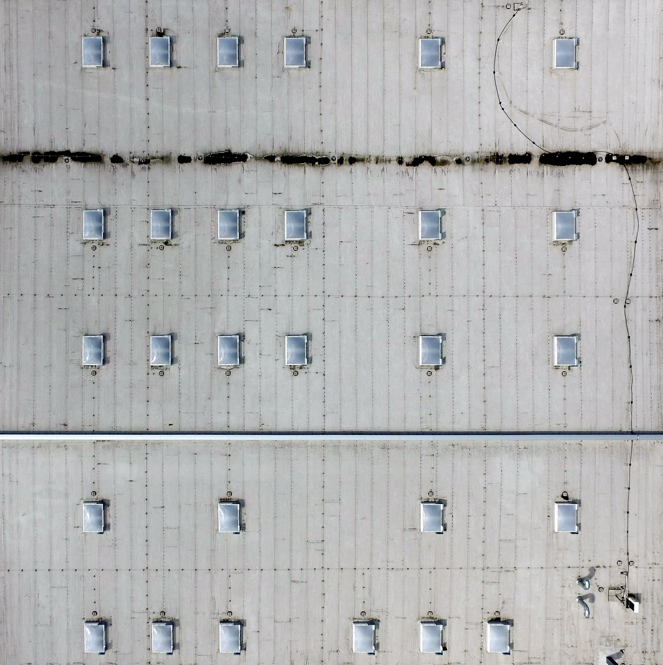 aerial shot of white flat roof