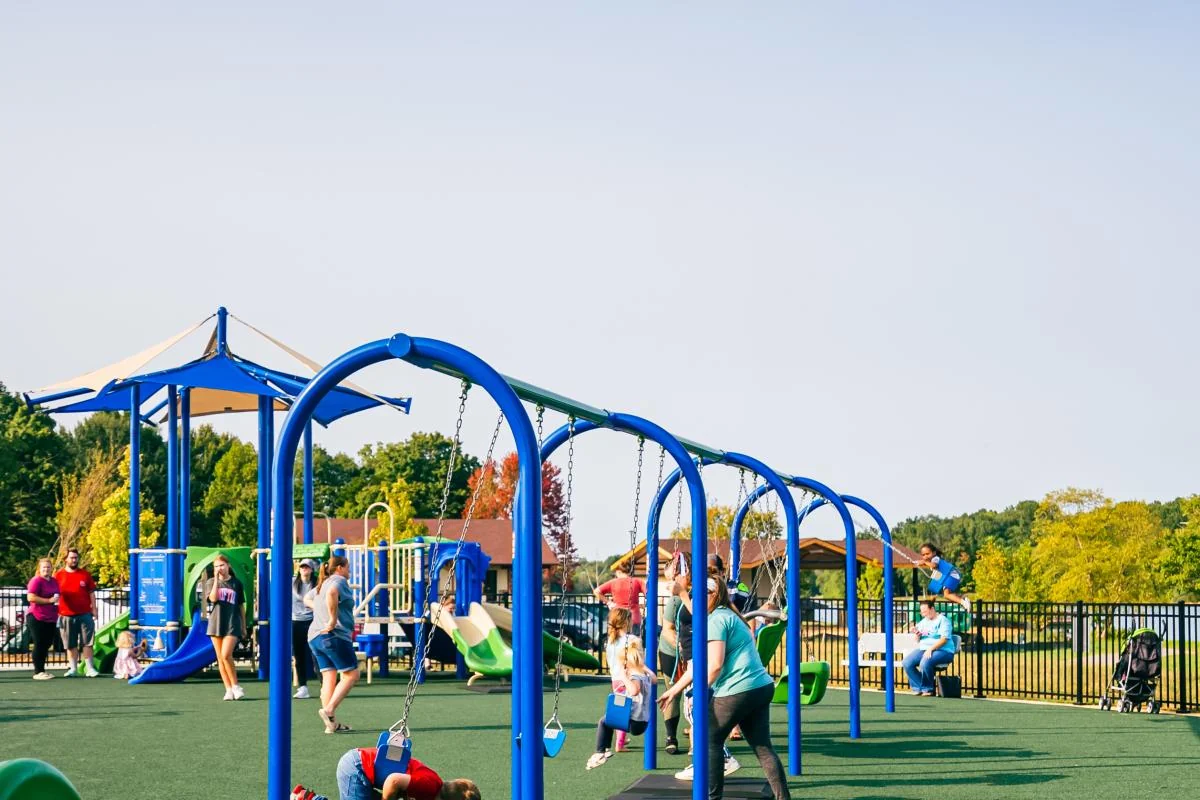 family enjoying time at a park or playground in Elizabethtown family enjoying time at a park or playground in Elizabethtown