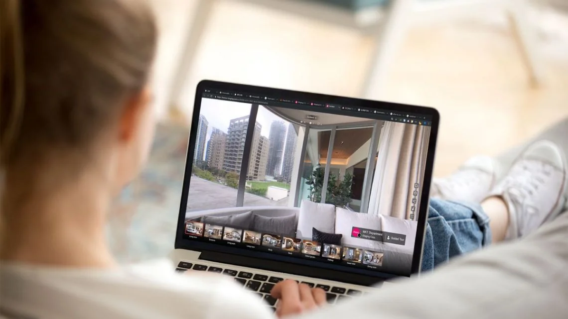 person using a laptop or tablet on a virtual tour, symbolizing remote viewing person using a laptop or tablet on a virtual tour, symbolizing remote viewing