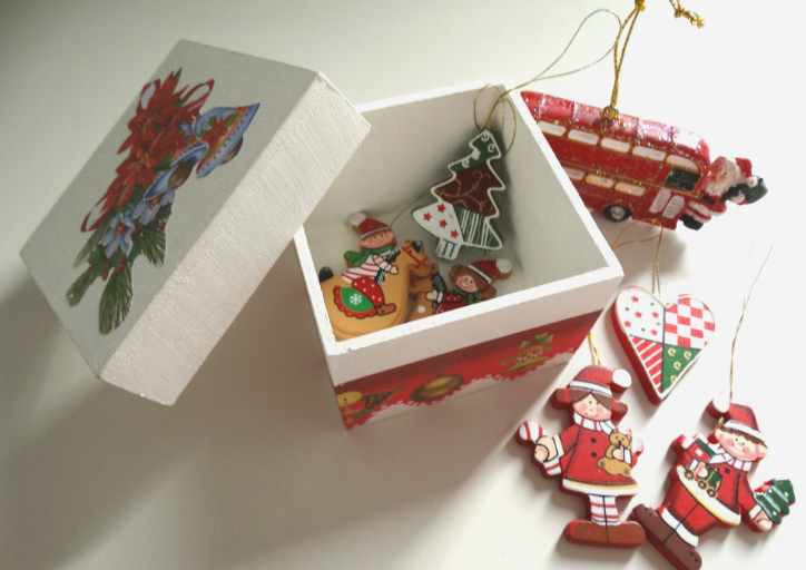 Sorting through ornaments to declutter Christmas decorations after Christmas