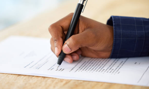 Man signing a term agreement