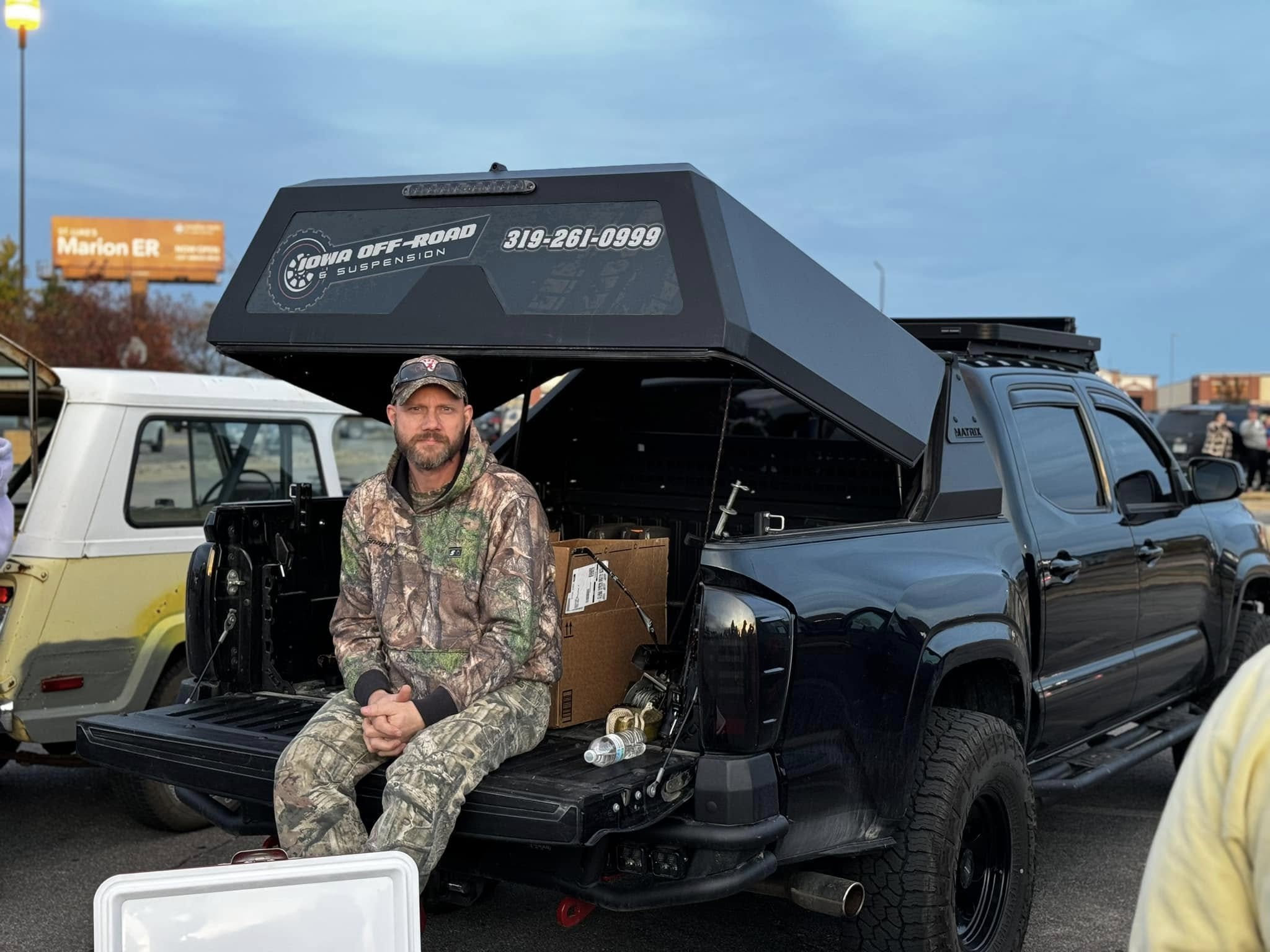Andy, the owner of Iowa Offroad & Suspension, sitting on a lifted truck, representing his journey from starting an automotive business to building a community for off-road enthusiasts. Andy, the owner of Iowa Offroad & Suspension, sitting on a lifted truck, representing his journey from starting an automotive business to building a community for off-road enthusiasts.