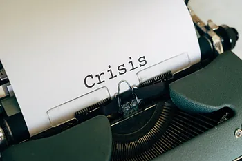 printer showing word, crisis