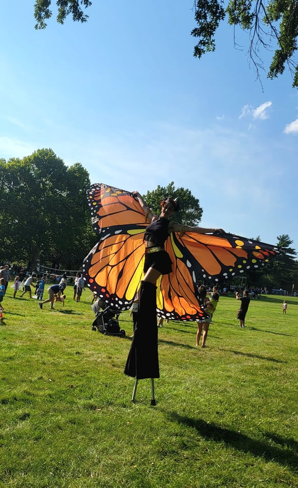 stilt walker on a butterfly costume