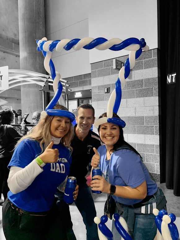 Women in blue with balloons