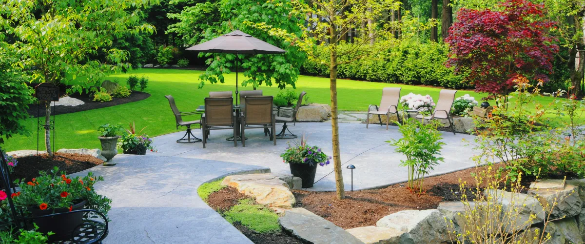 Luxury garden seating area with modern outdoor furniture and vibrant landscaping