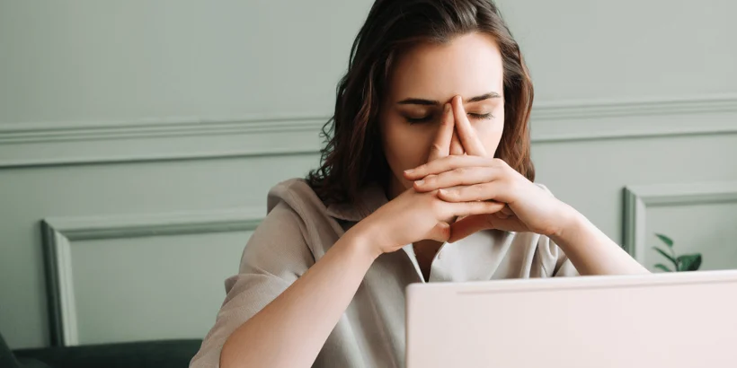 A person struggling to focus on a task due to trauma A person struggling to focus on a task due to trauma