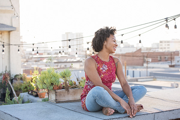 woman relaxing at the rooftop woman relaxing at the rooftop