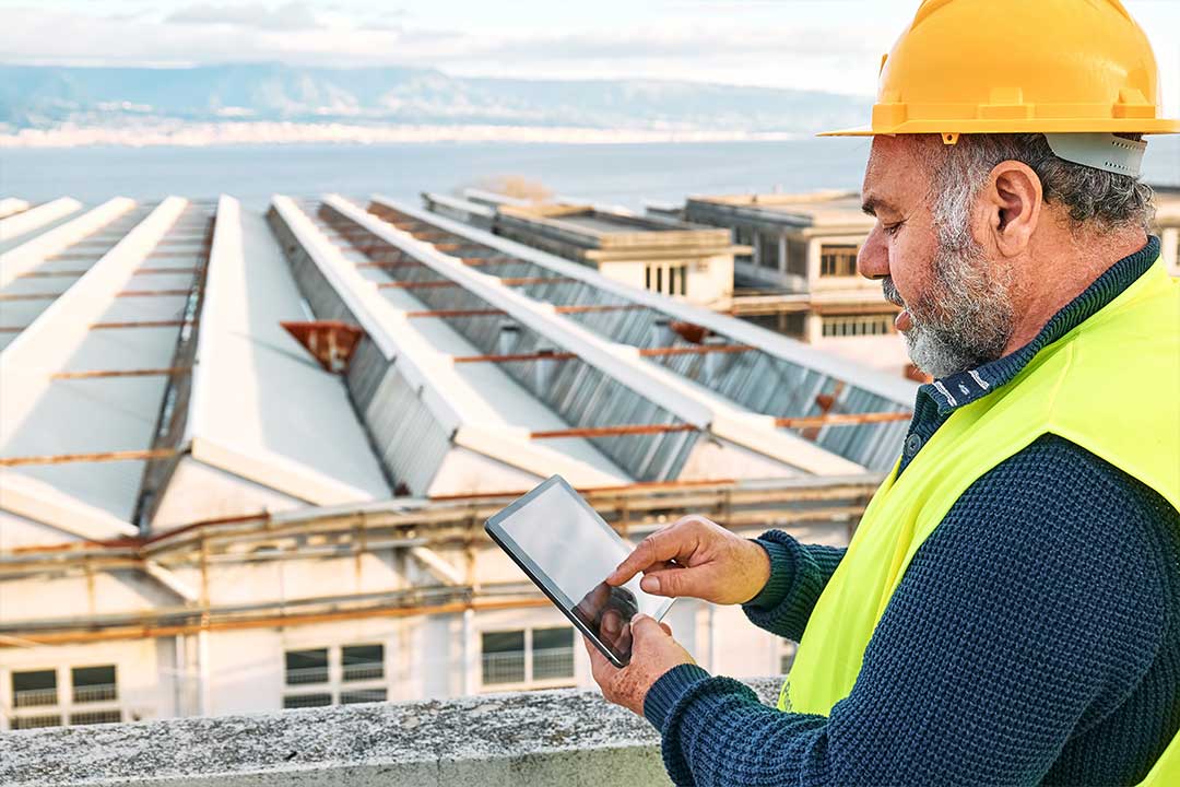 a roofer performing a maintenance inspection a roofer performing a maintenance inspection
