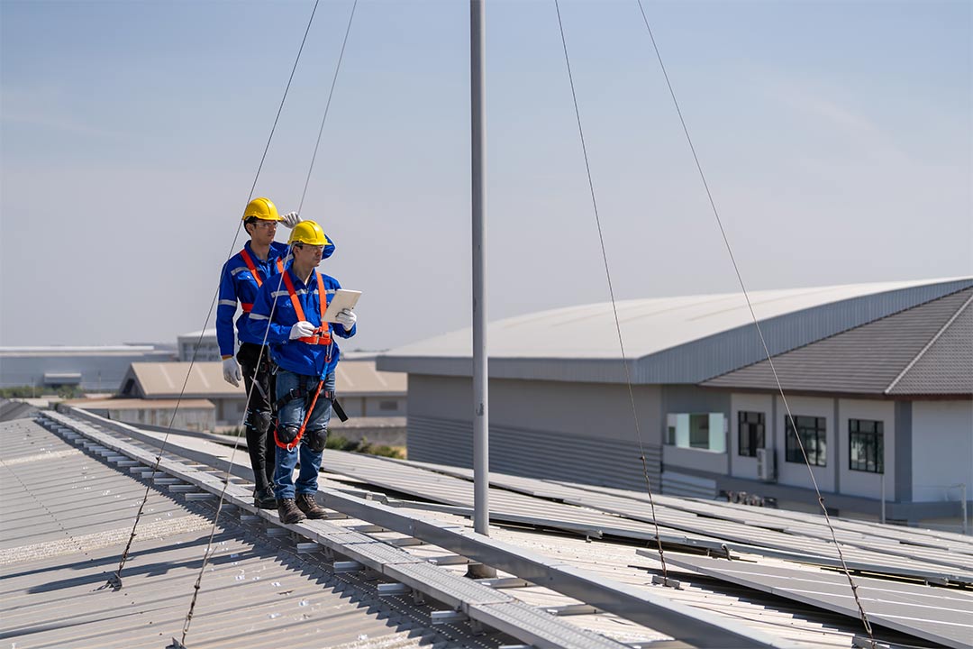 a roofer performing routine maintenance a roofer performing routine maintenance