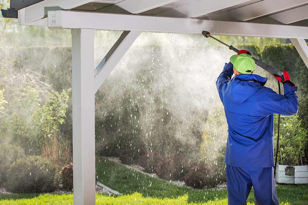 a roofer performing maintenance; cleaning gutters a roofer performing maintenance; cleaning gutters