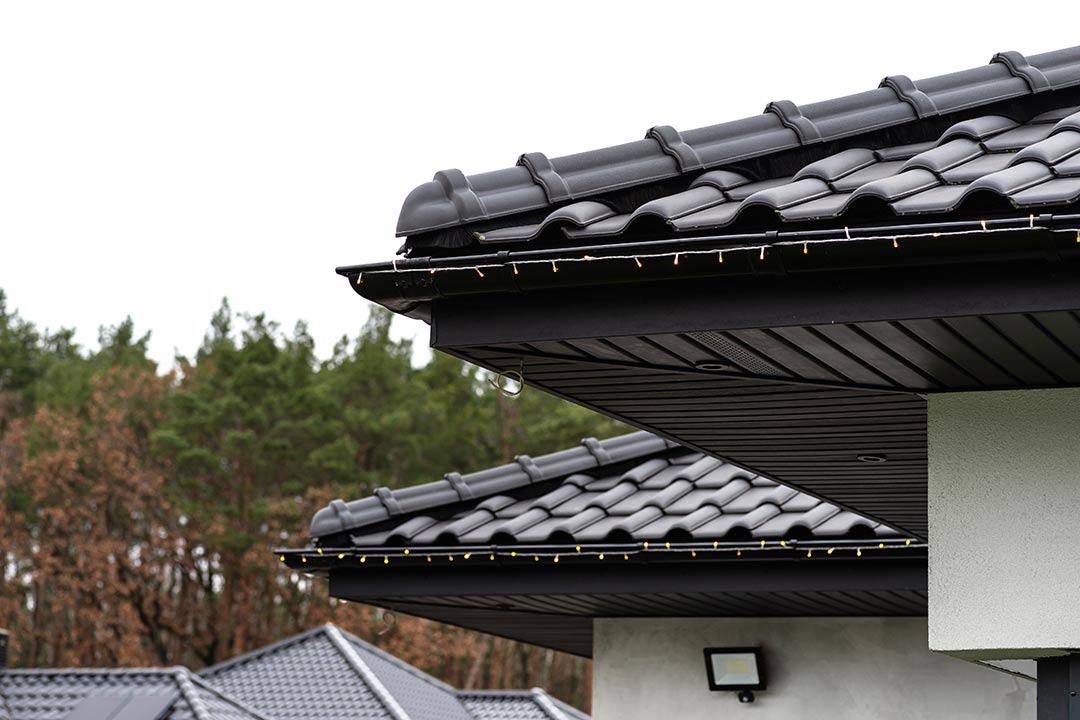 roof with a clean gutter and downspout roof with a clean gutter and downspout