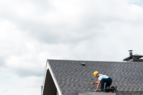 a professional performs roof maintenance, making repairs as needed to ensure the roof's longevity a professional performs roof maintenance, making repairs as needed to ensure the roof's longevity