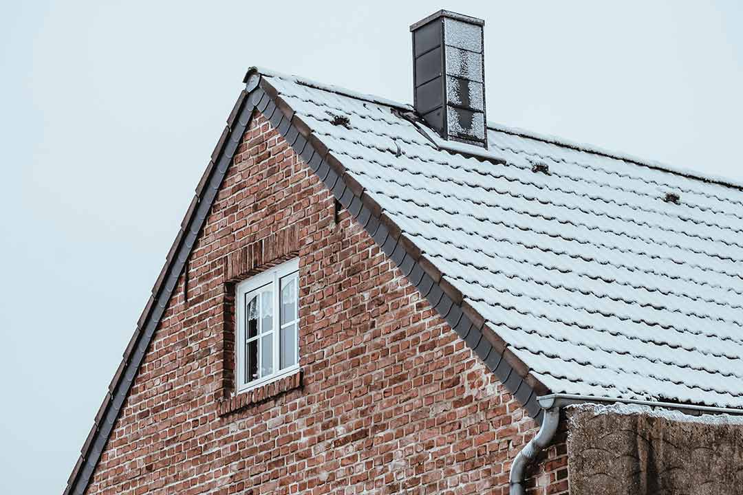 snow slowly covering the roof shingles snow slowly covering the roof shingles