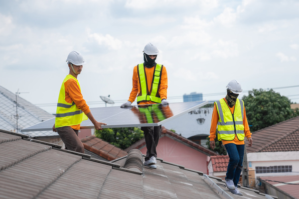 workers repair storm-damaged roof for safety workers repair storm-damaged roof for safety