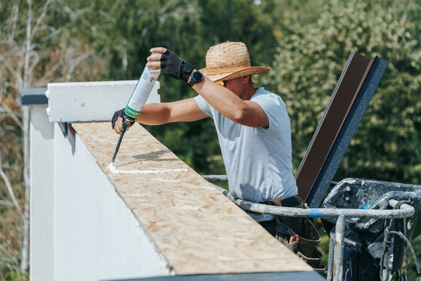 a worker lacking tools struggles with roofing tasks a worker lacking tools struggles with roofing tasks