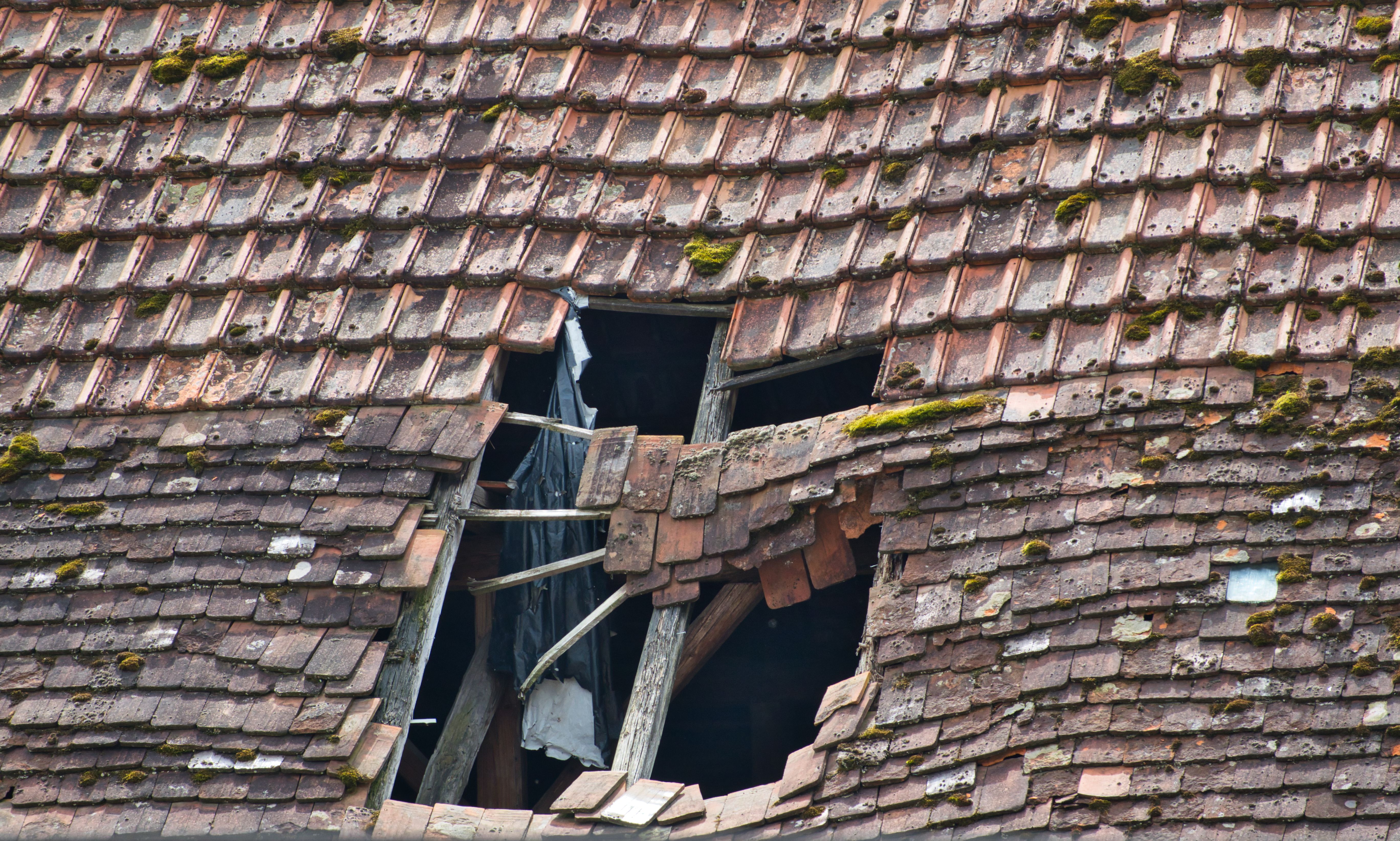 roof displaying severe damage roof displaying severe damage