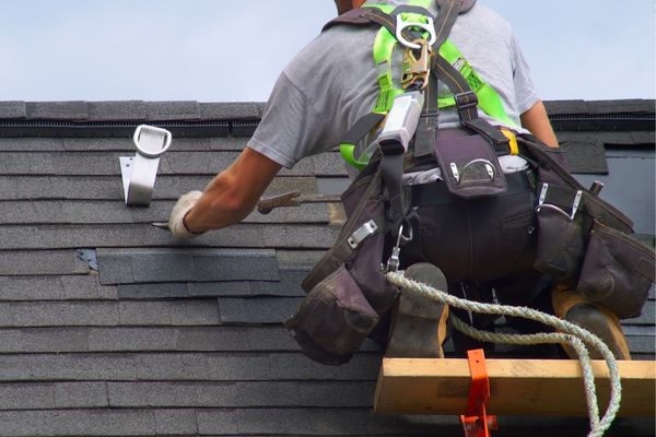 Professional roofer repairing hail-damaged shingles, emphasizing the importance of timely roof maintenance after severe weather. Professional roofer repairing hail-damaged shingles, emphasizing the importance of timely roof maintenance after severe weather.