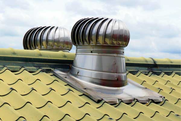 Metal roof turbines installed for ventilation, showcasing an efficient solution for maintaining airflow and reducing heat buildup. Metal roof turbines installed for ventilation, showcasing an efficient solution for maintaining airflow and reducing heat buildup.