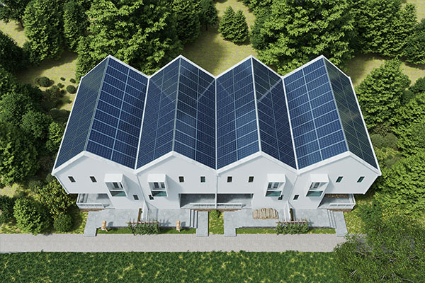 Aerial view of a row of modern houses with solar panel roofing, surrounded by lush greenery, highlighting eco-friendly and sustainable roofing solutions. Aerial view of a row of modern houses with solar panel roofing, surrounded by lush greenery, highlighting eco-friendly and sustainable roofing solutions.