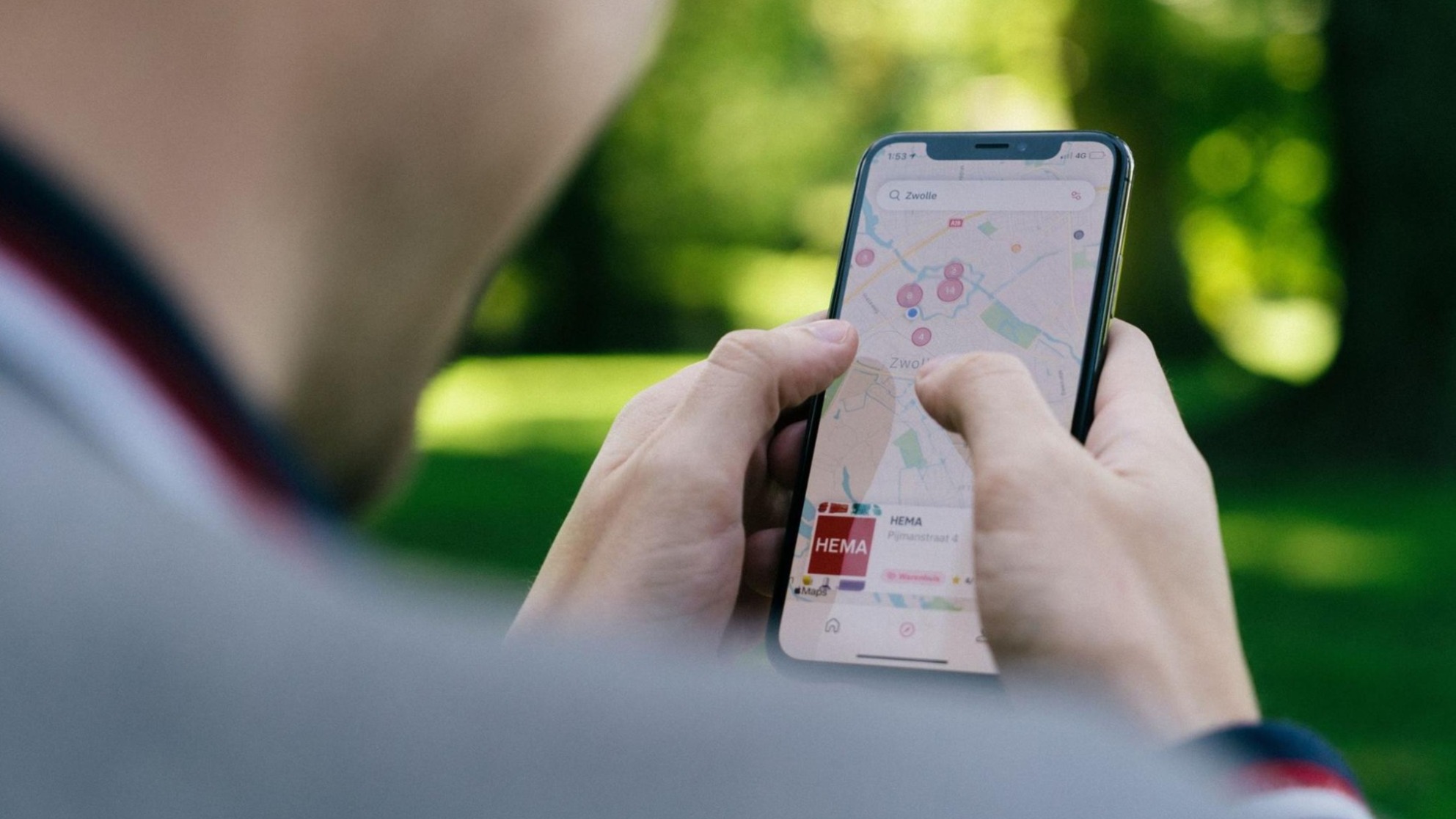 digital marketing - man searching Google Maps on phone