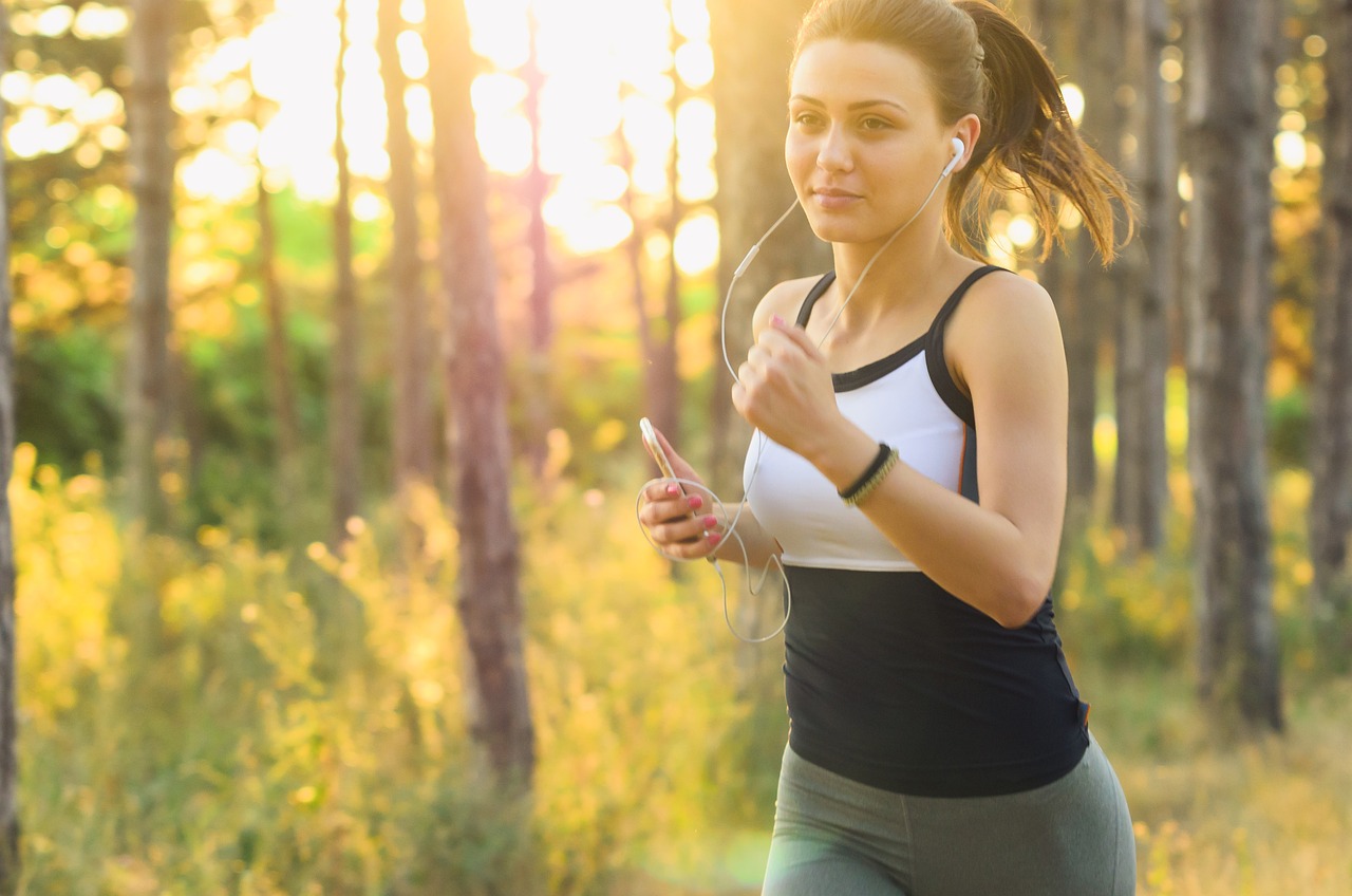 Woman jogging outdoors with energy and joy after healing