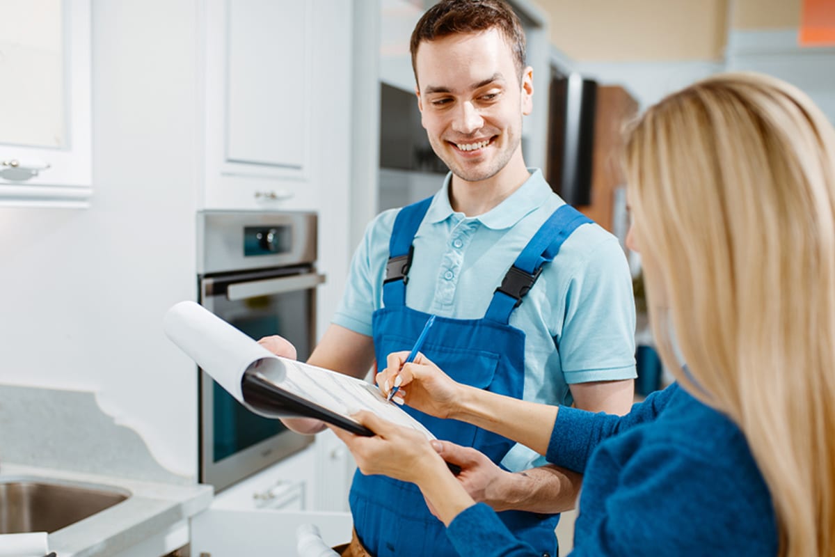 Happy Plumber Working with Customer Happy Plumber Working with Customer