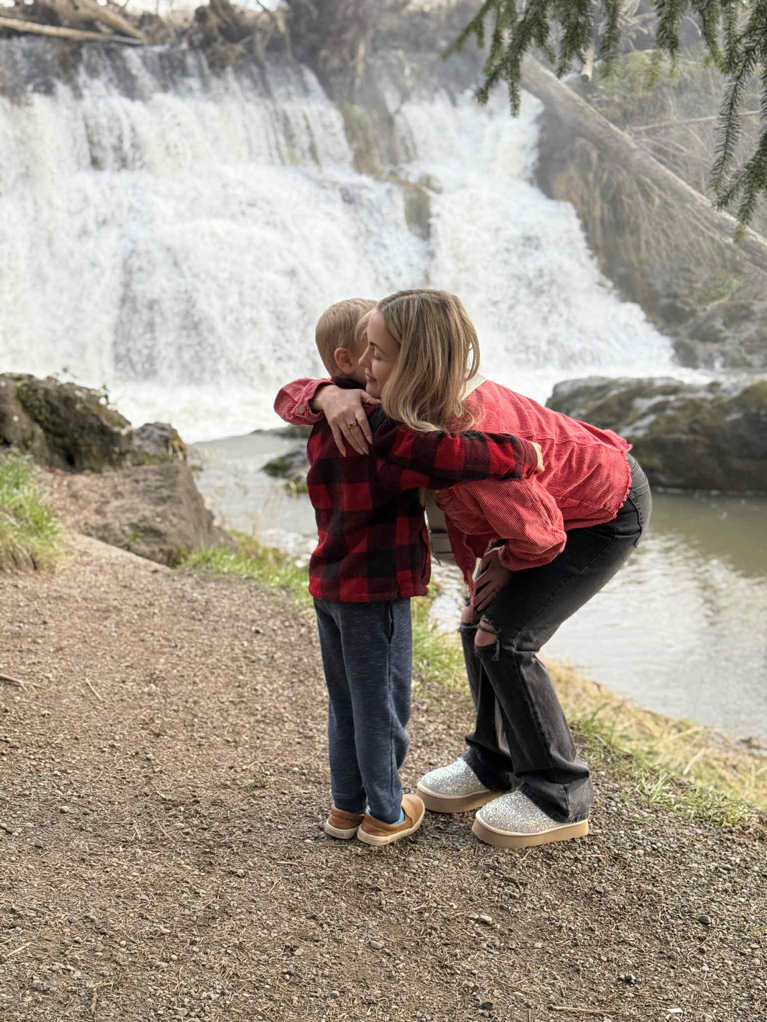 Stephanie Noble hugging her son outside