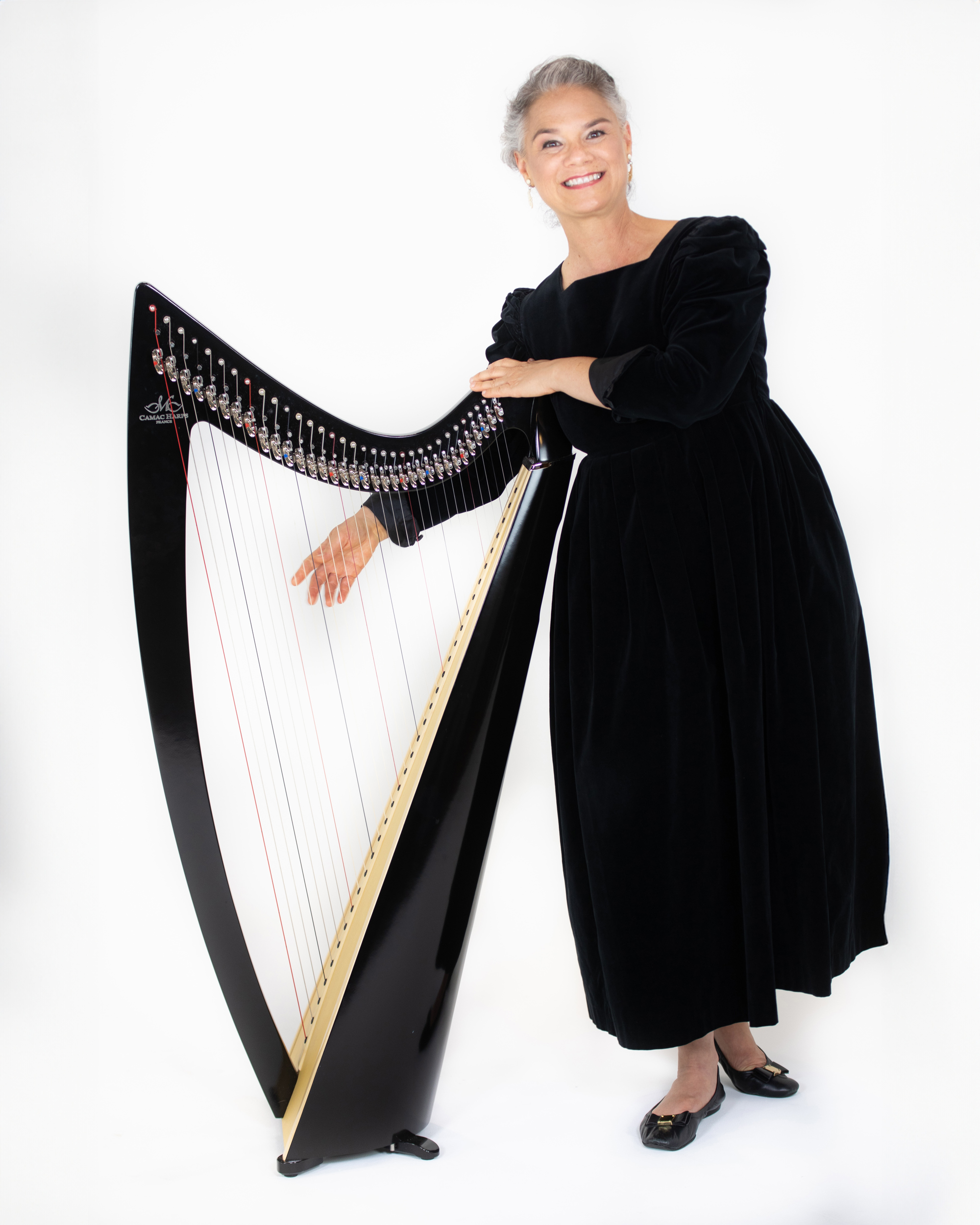 Harp player in photo studio in Hawaii. Harp player in photo studio in Hawaii.