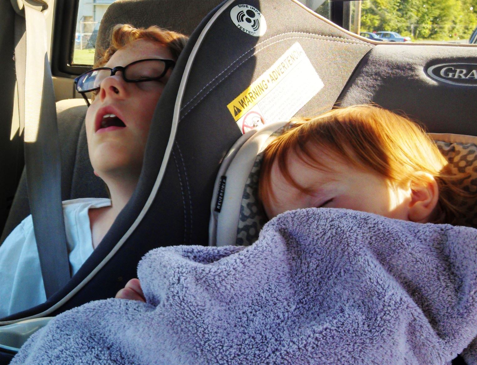 Eamon and Fiona sleeping in the car on the Necessity of Napping on Shalavee.com